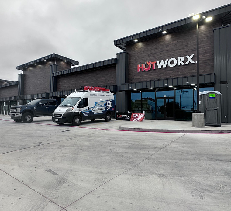 HOTWORX fitness studio with Wired Generations branded van on site
